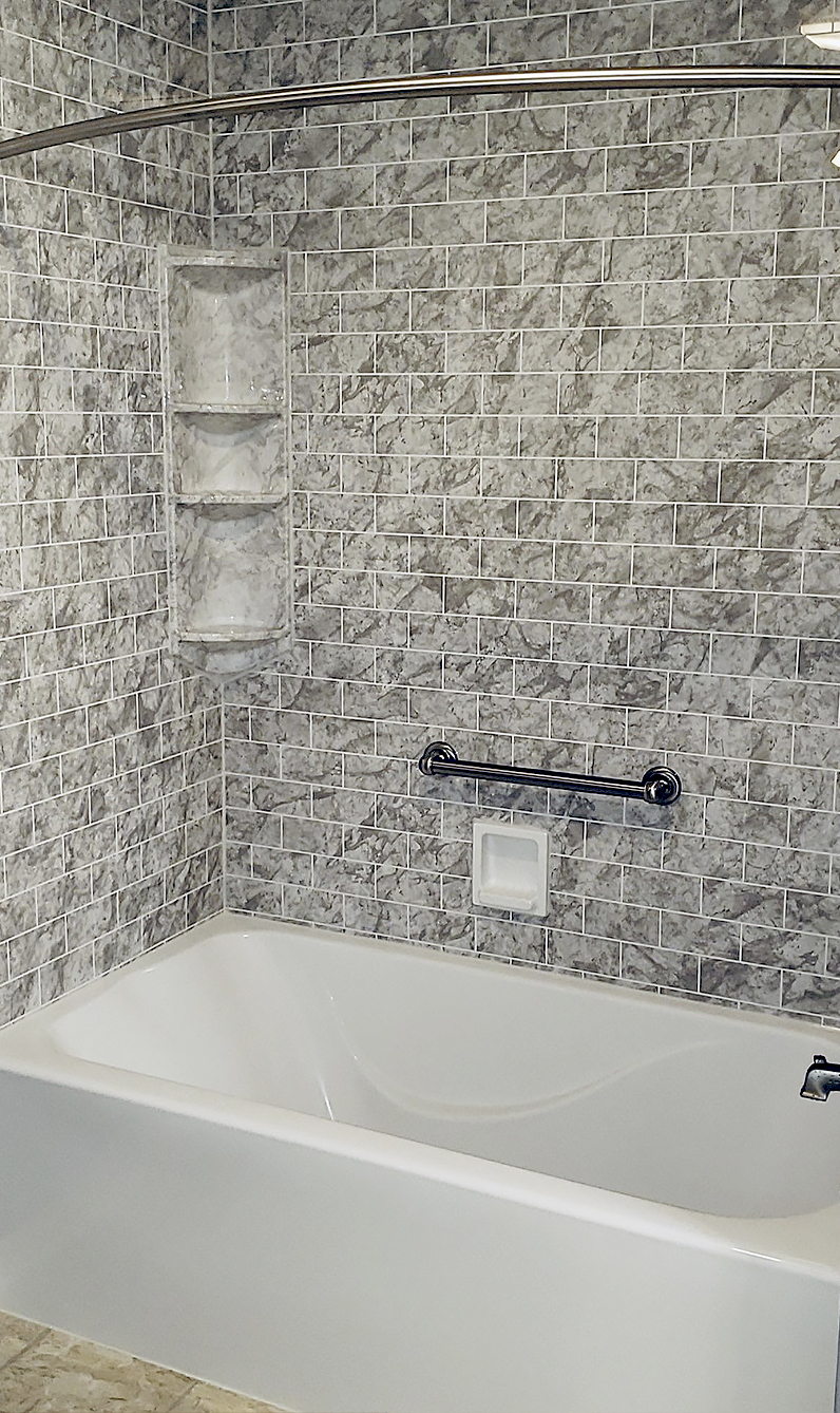 luxury shower with tile wall