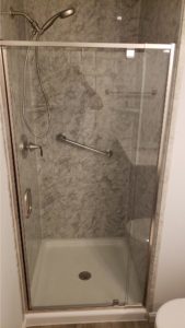 shower with pivot door with hand held chrome grab bar