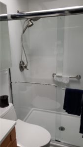 white smooth shower with standard glass slider