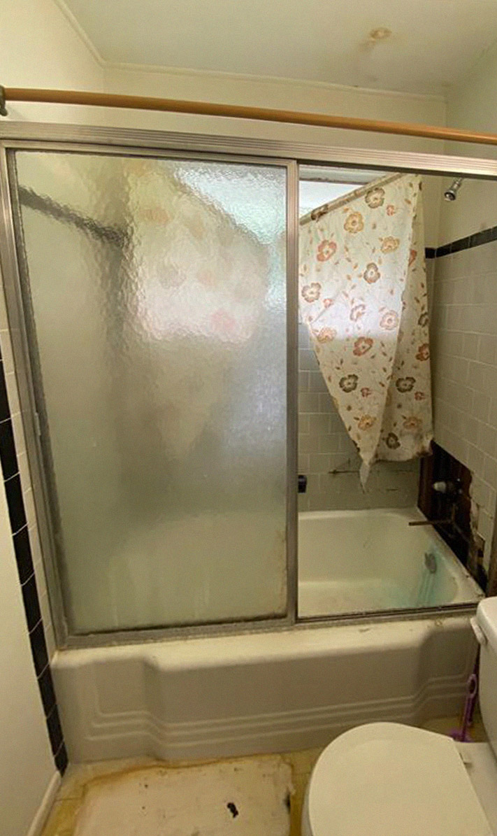 before photo of old half-bath with sliding glass door
