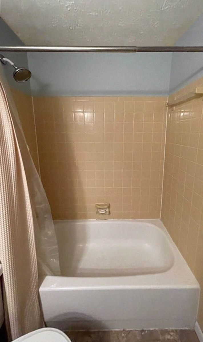 before image of half-bath with brown tiling