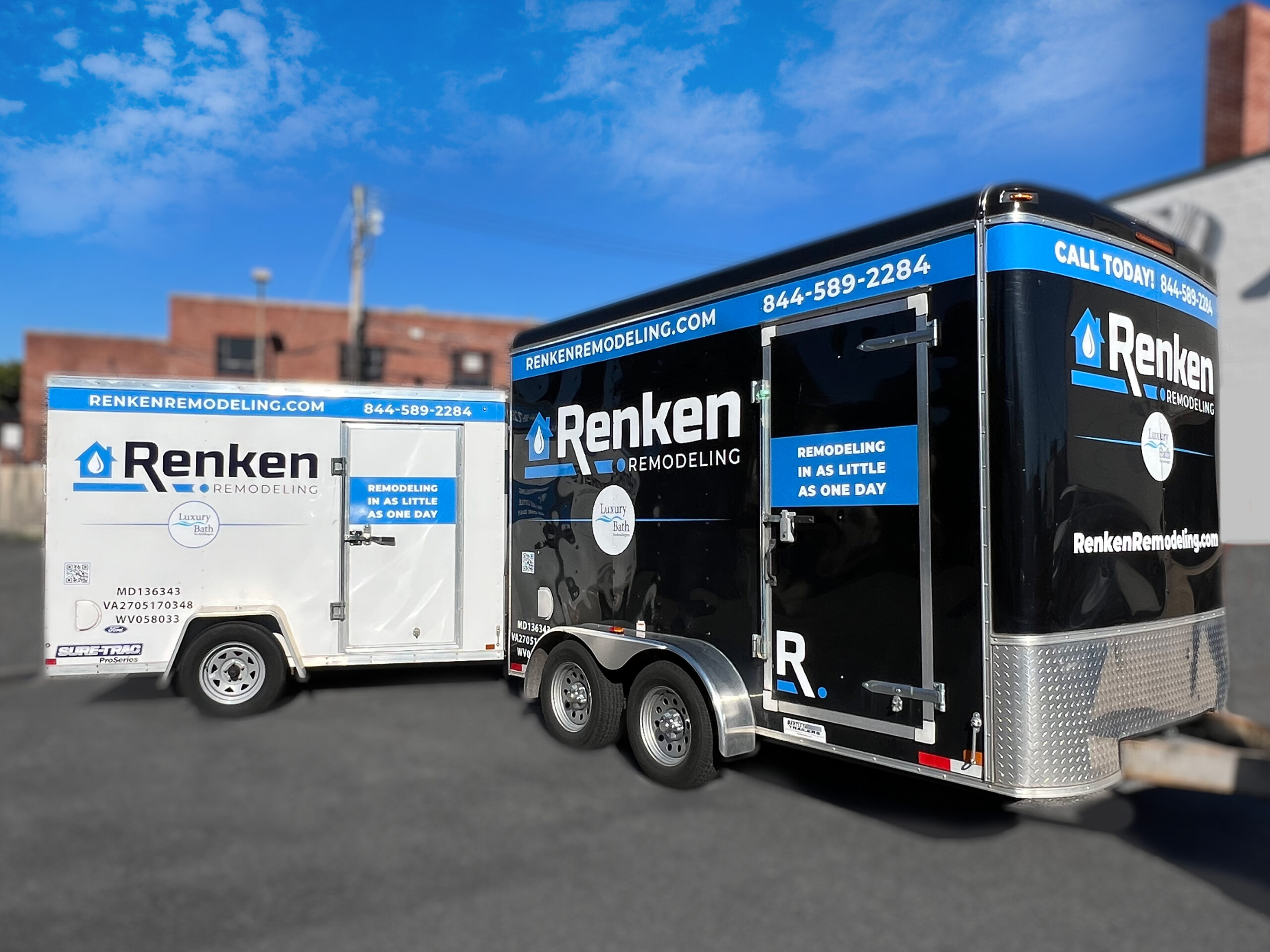 one black and one white renken remodeling trailers