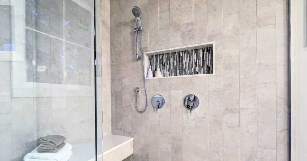 large shower conversion made to be accessible with the addition of a shower bench