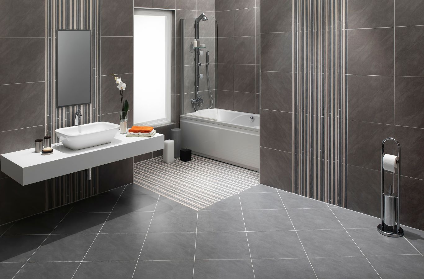 Benefits of Bathroom Flooring in Frederick, MD by Renken Remodeling A Renken Remodeling team member laying new bathroom flooring in Frederick, MD, highlighting the benefits of moisture-resistant finishes.