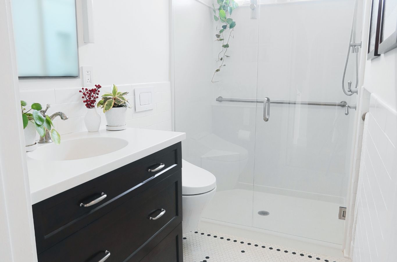 A Renken Remodeling team member showcasing the benefits of remodeling in Frederick, MD with premium flooring and shower upgrades.