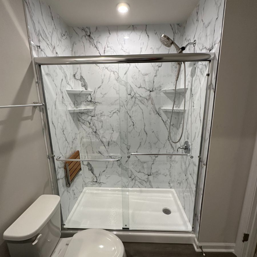 Renken Remodeling team member working on bathroom remodeling in Ashburn, VA, showcasing quality upgrades and reliable service.