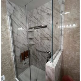 Carrara-Custom-Door-Rainhead-with-Travertine-Walls-Outside