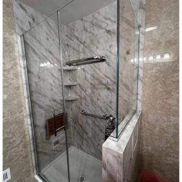 Carrara-Custom-Door-Rainhead-with-Travertine-Walls-Outside-scaled